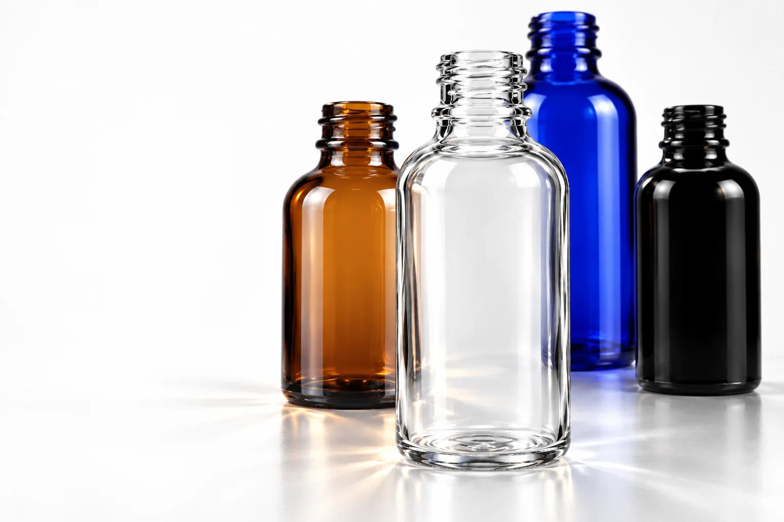 Amber, clear, blue and black glass bottles